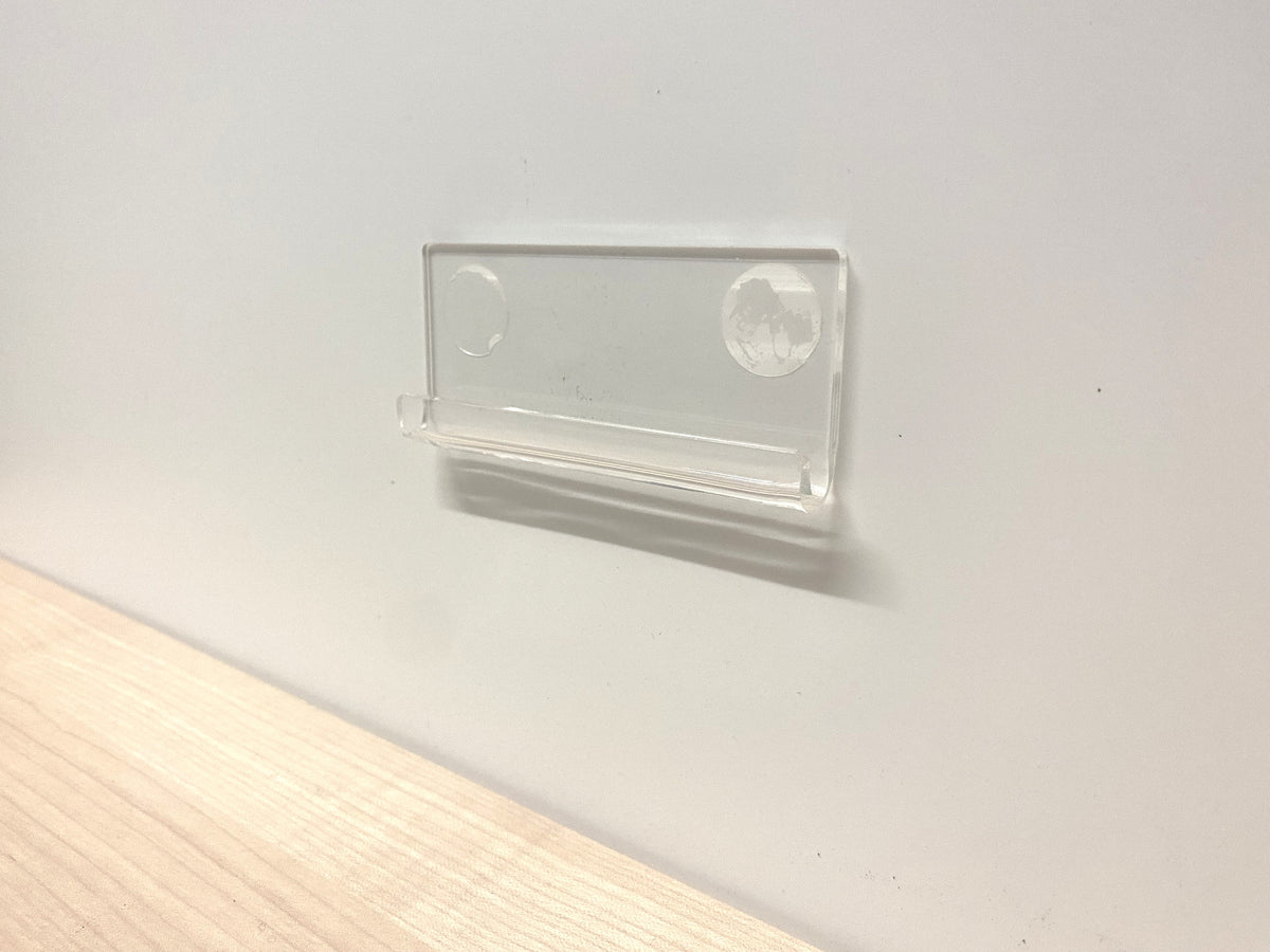 a viiew of a  clear clip for wall mounting of vinyl lp records