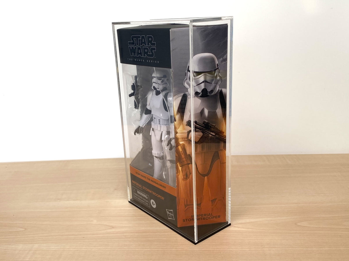 Side view of clear acrylic display case for boxed action figure