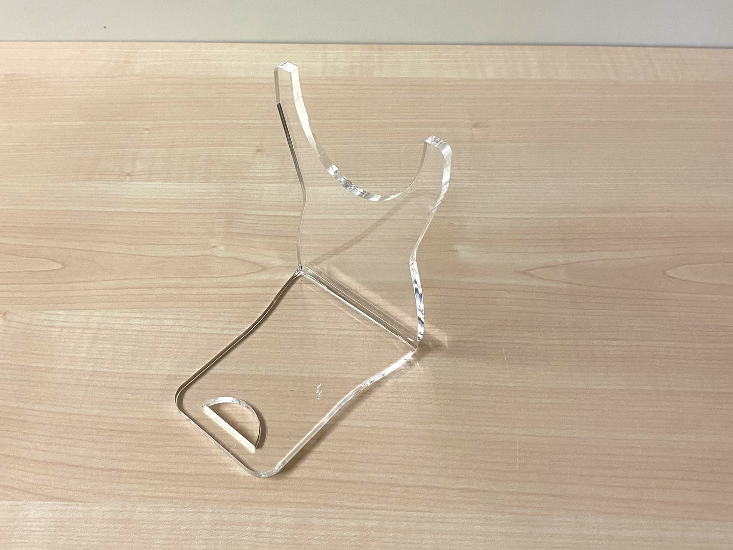 Clear acrylic wine bottle stand showing floating angled design for 74mm bottles