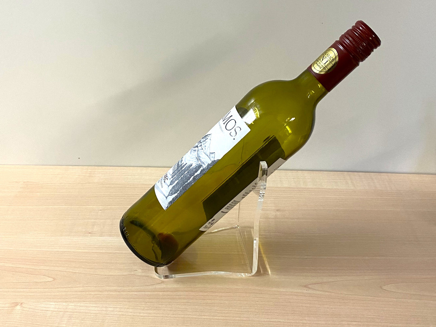 Close-up of angled acrylic holder highlighting label visibility and craftsmanship